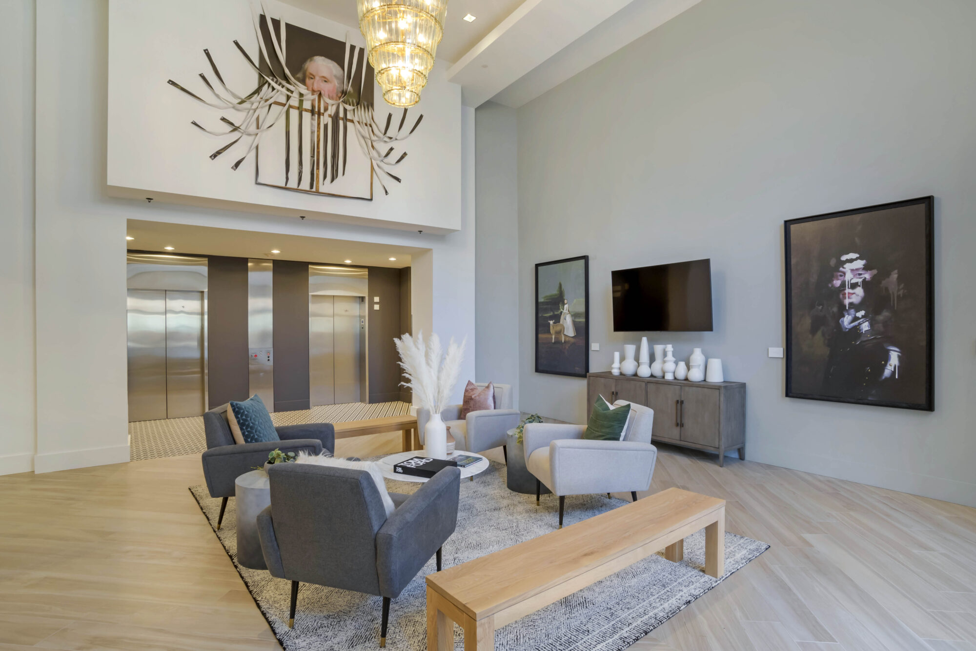 Leasing lobby with lounge seating and TV